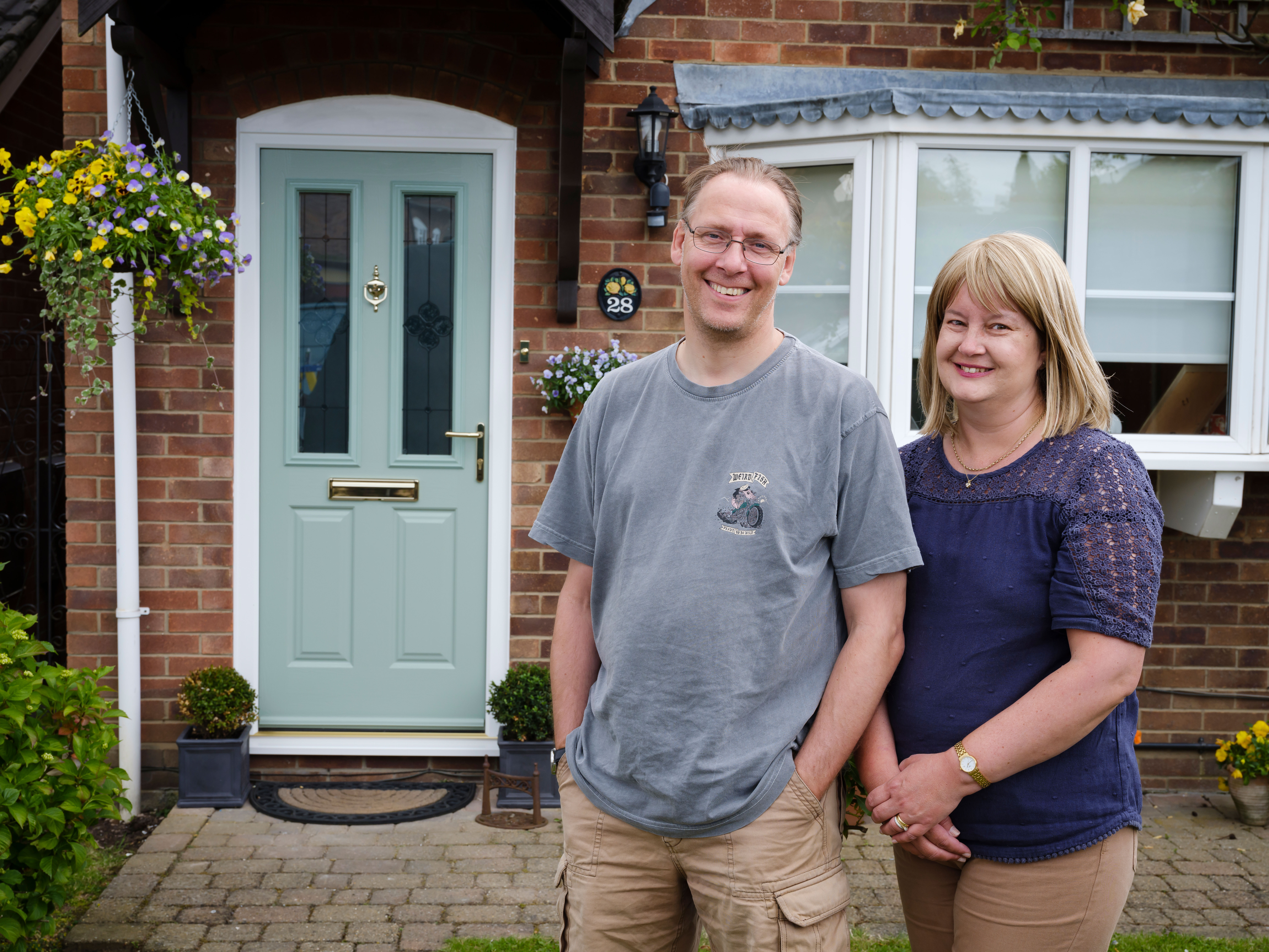 A happy customer Caroline satisfied with the work quality of Endurance doors